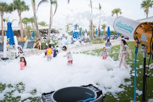 Kids covered in foam at a backyard birthday party