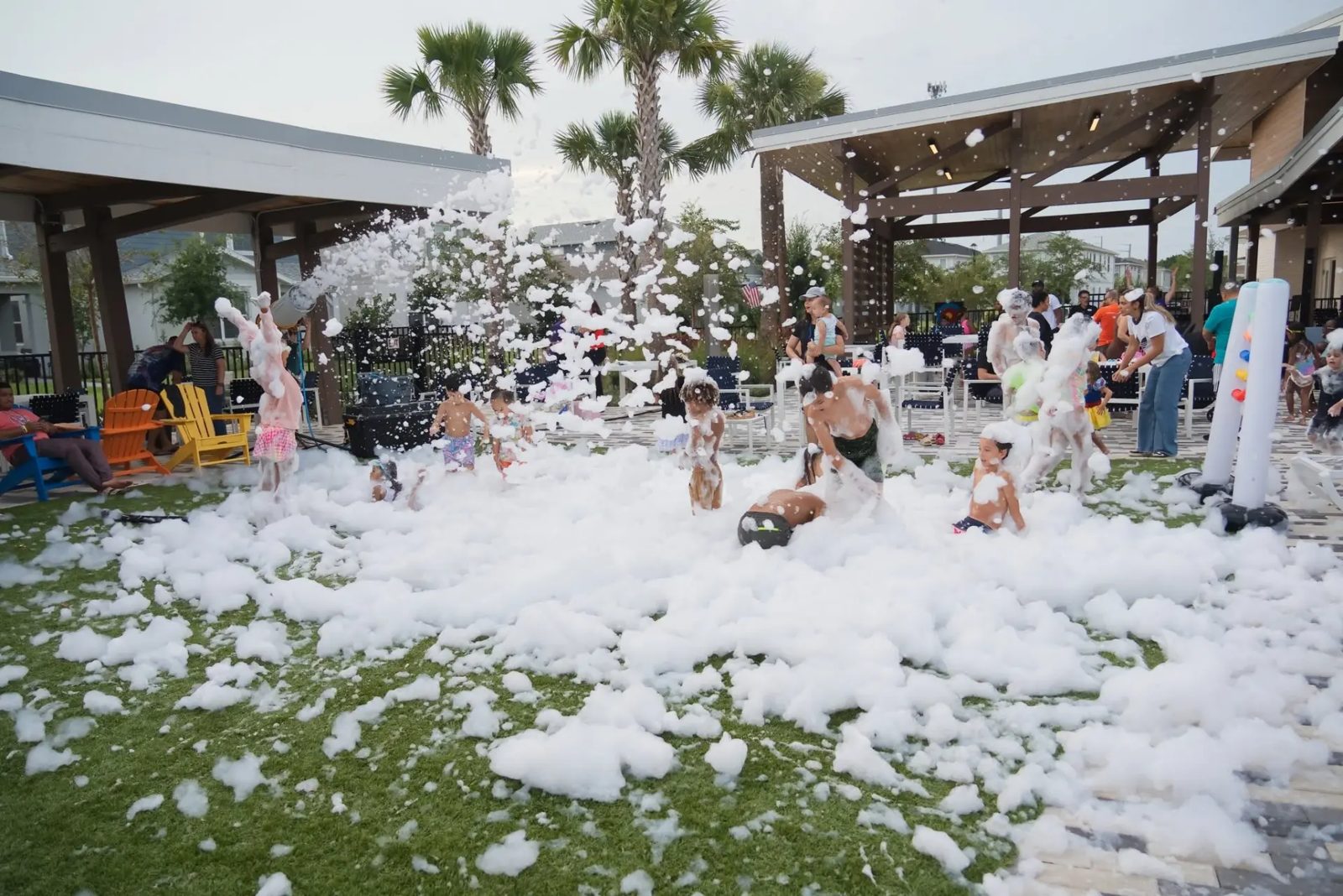 Foam cannon spraying over a group of guests