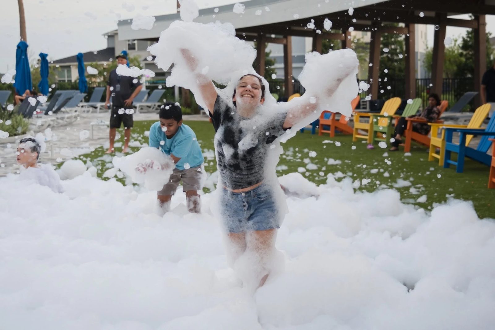 Teens playing in a deep foam pit